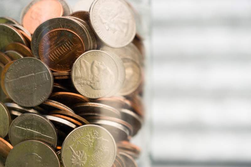 american-dollar-currency-coins-in-jar-pennies