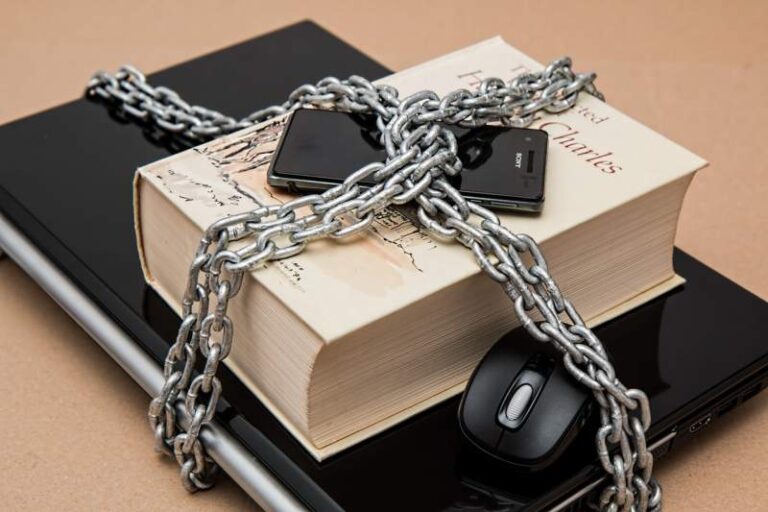 black-android-smartphone-on-top-of-white-book