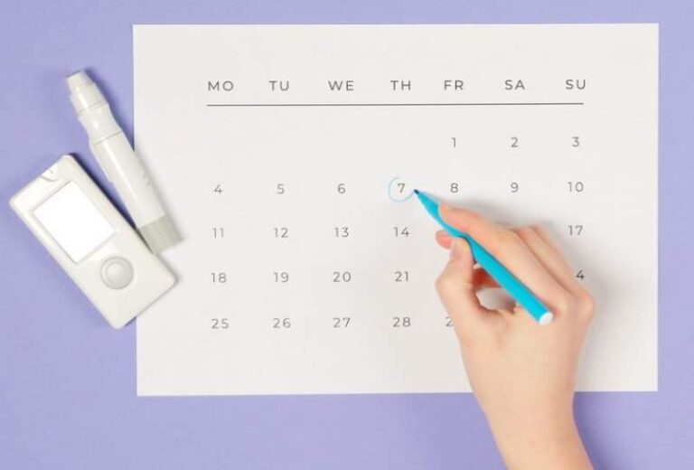 person-drawing-a-circle-on-a-calendar